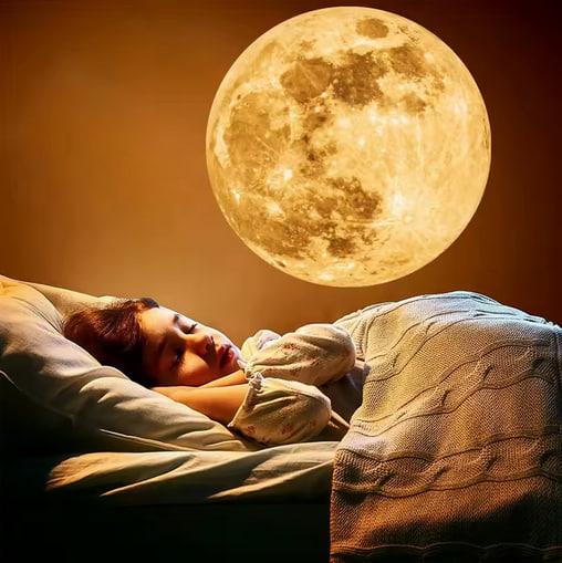 Child Sleeping Under Moon Projection Lamp on Wall - Soothing Night Light for Kids